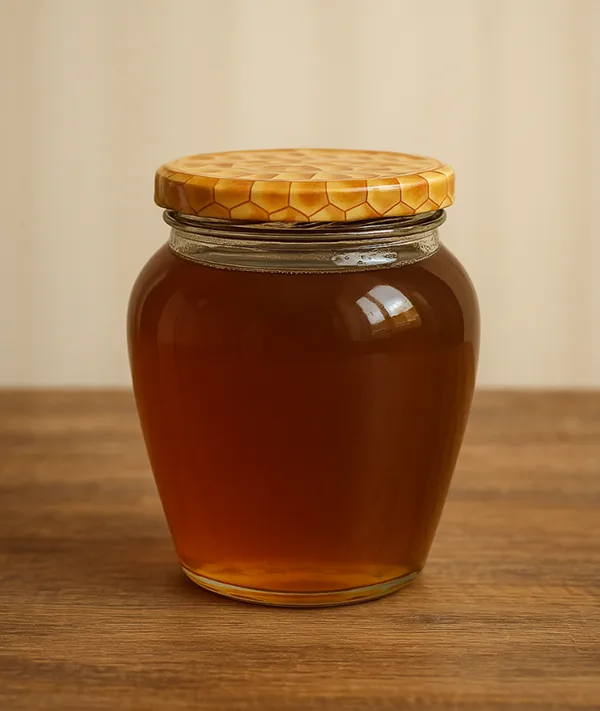 ცაცხვის თაფლი ღია ფერის ქილაში